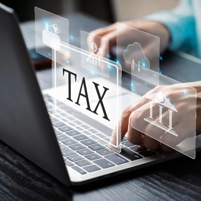 businessman-using-computer-laptop-income-tax-online-return-tax-payment-digital-tablet-virtual-screen-financial-research-electronic-signature-calculation-tax-return